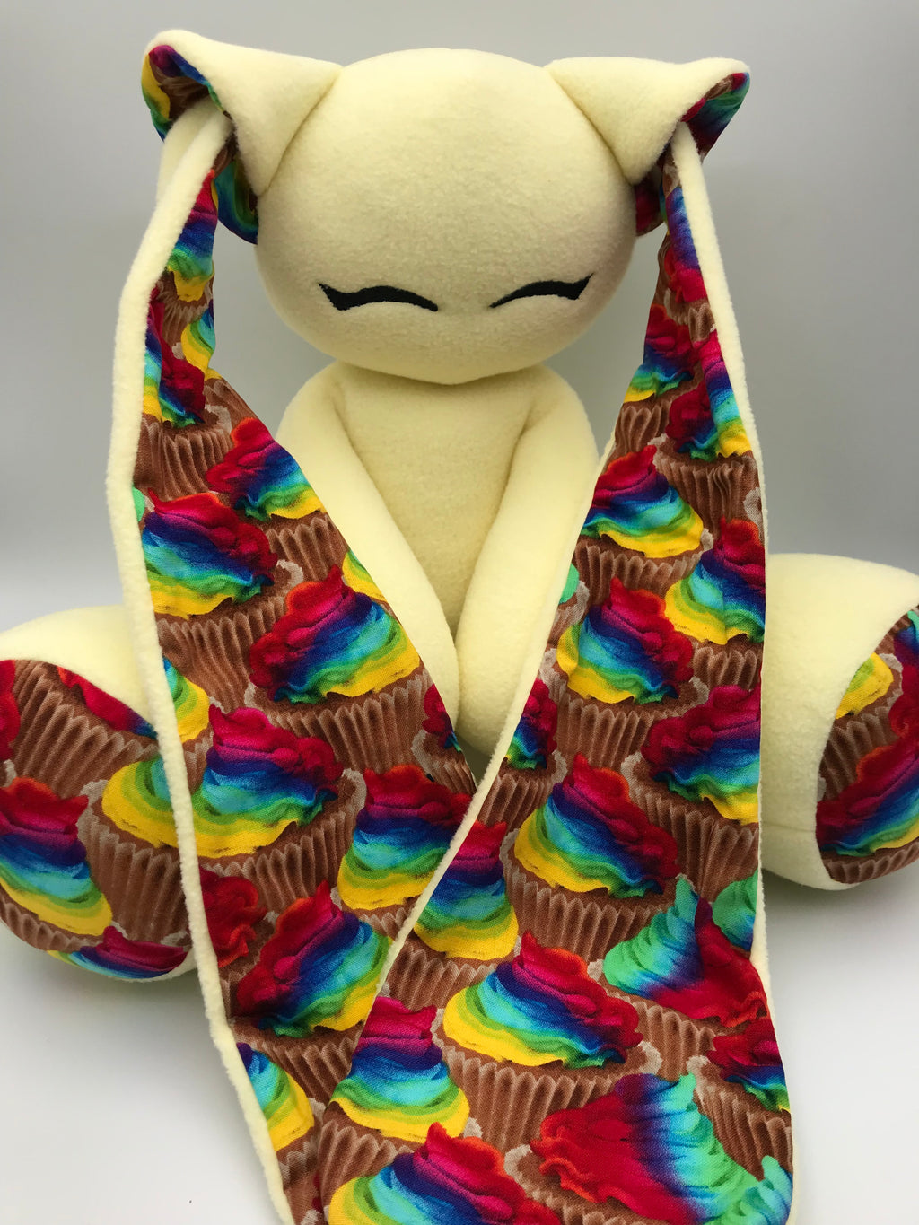 Yellow Cabbit with rainbow cupcakes
