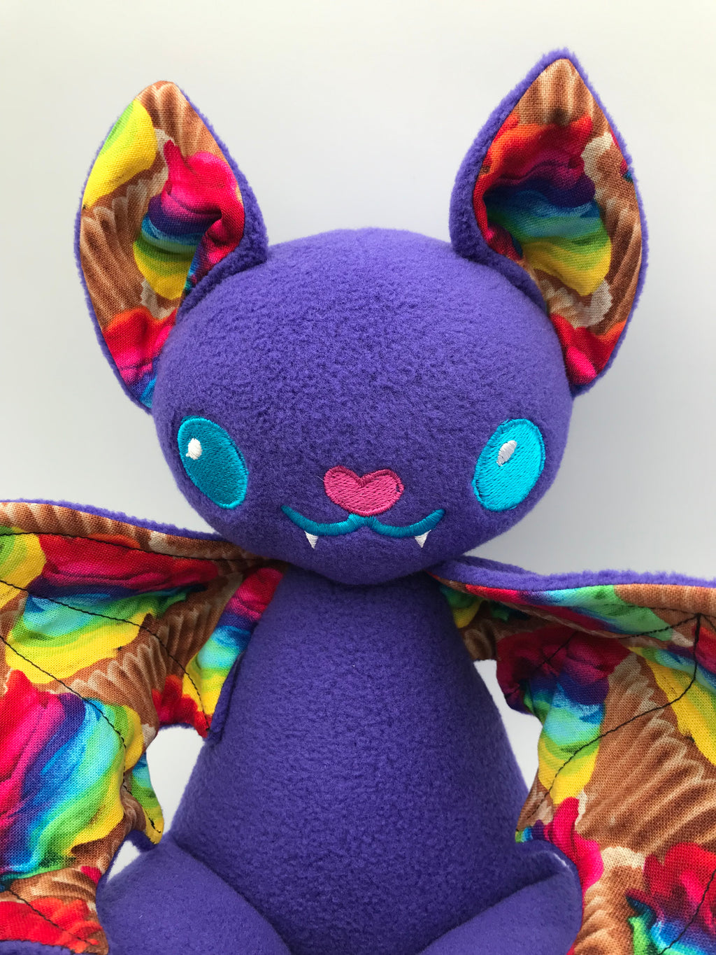 Small purple cupcake bat