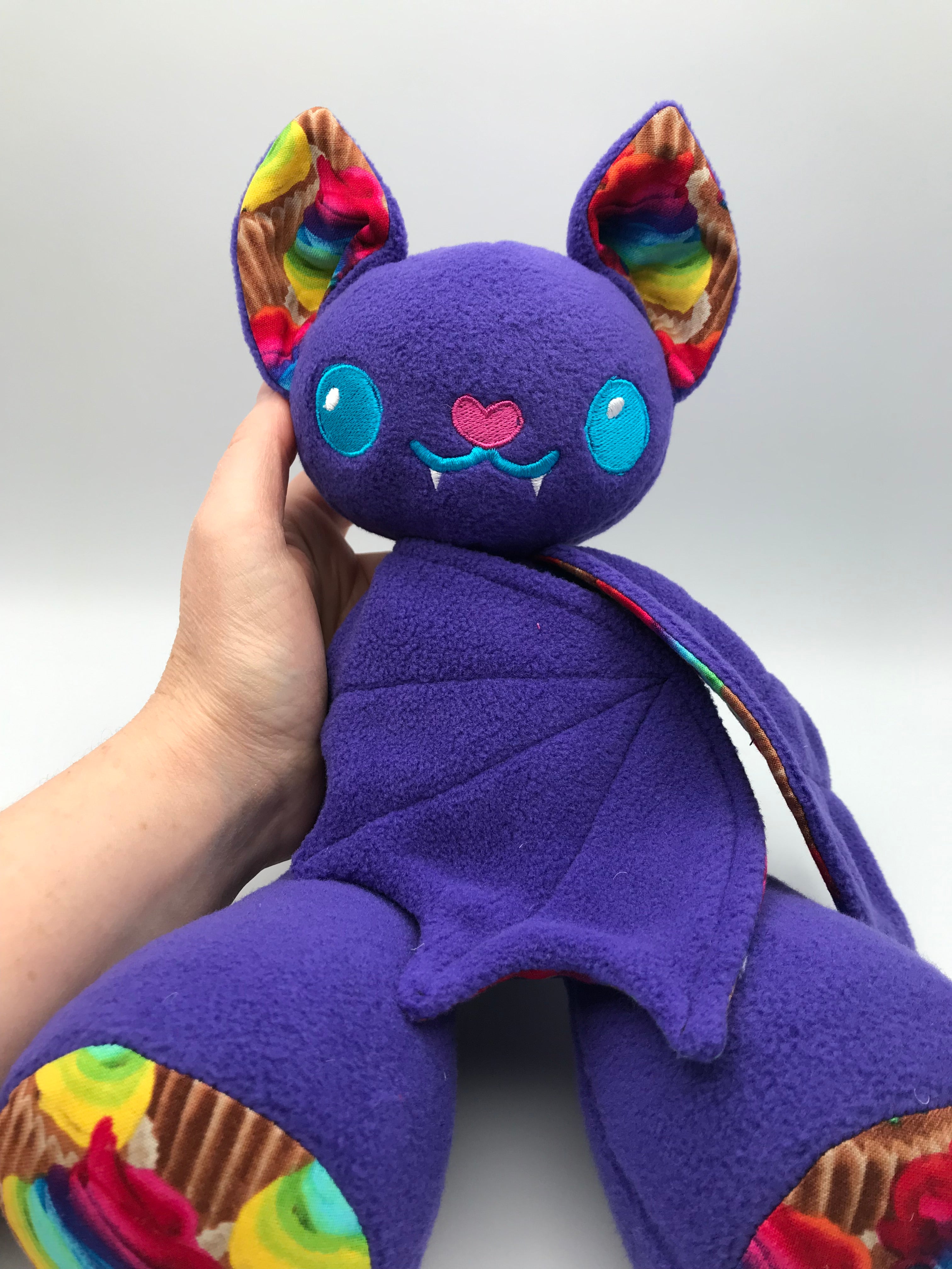 Small purple cupcake bat